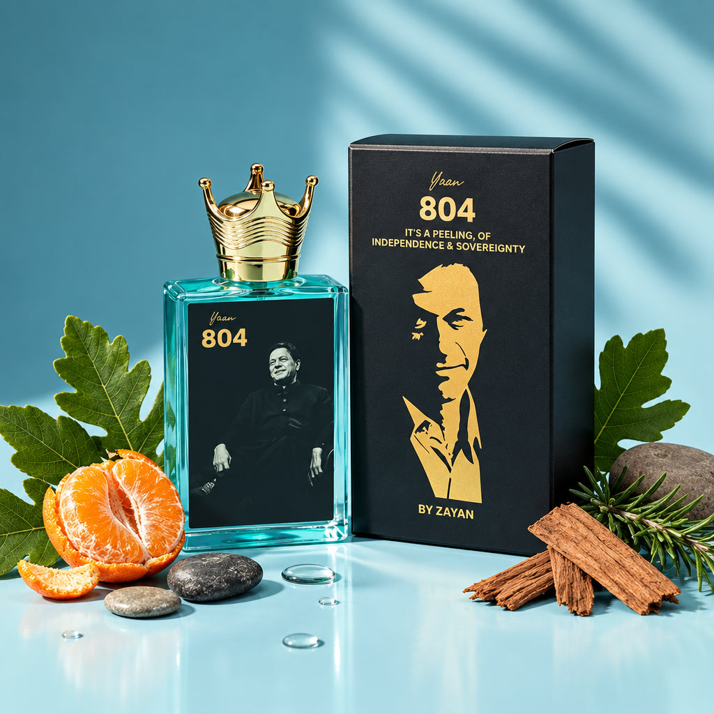 Perfume bottle with packaging and ingredients on a blue background