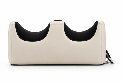 Beige pet carrier with black interior on a white background