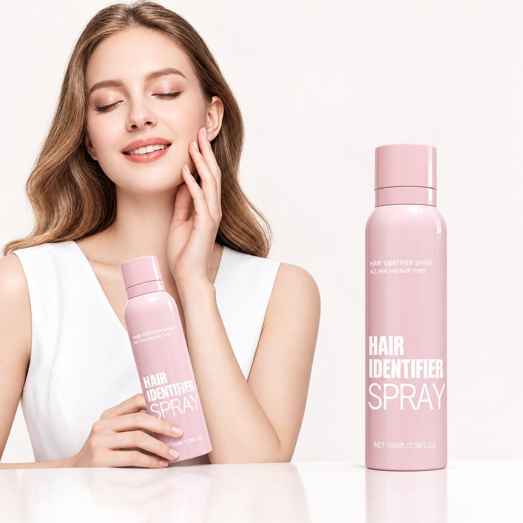 Woman holding a pink bottle of 'Hair Identifier Spray' with a plain background
